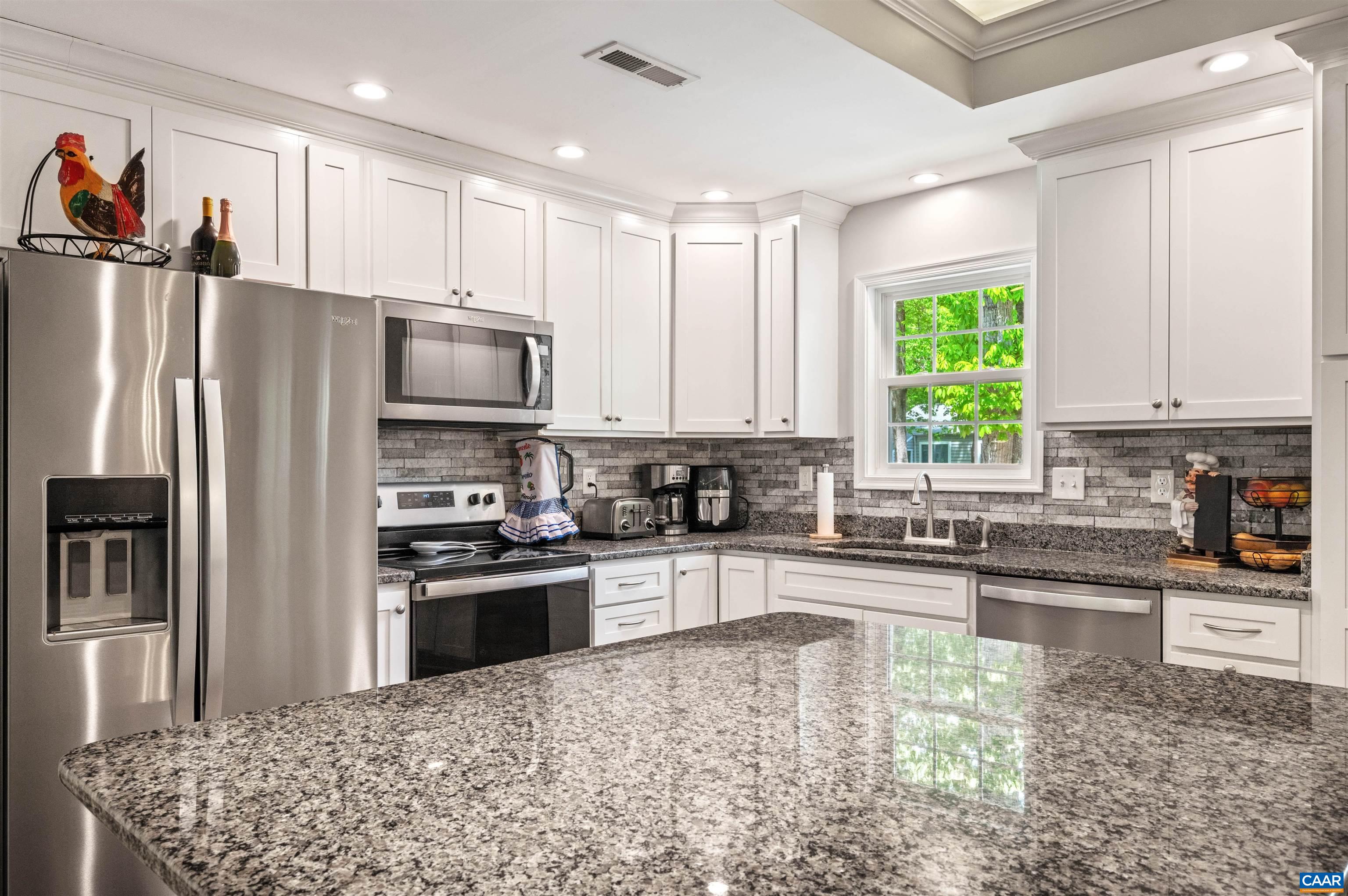 31 Oak Grove Road Palmyra, VA 22963 - Photo 10 of 28 a kitchen with stainless steel appliances granite countertop a refrigerator sink and stove