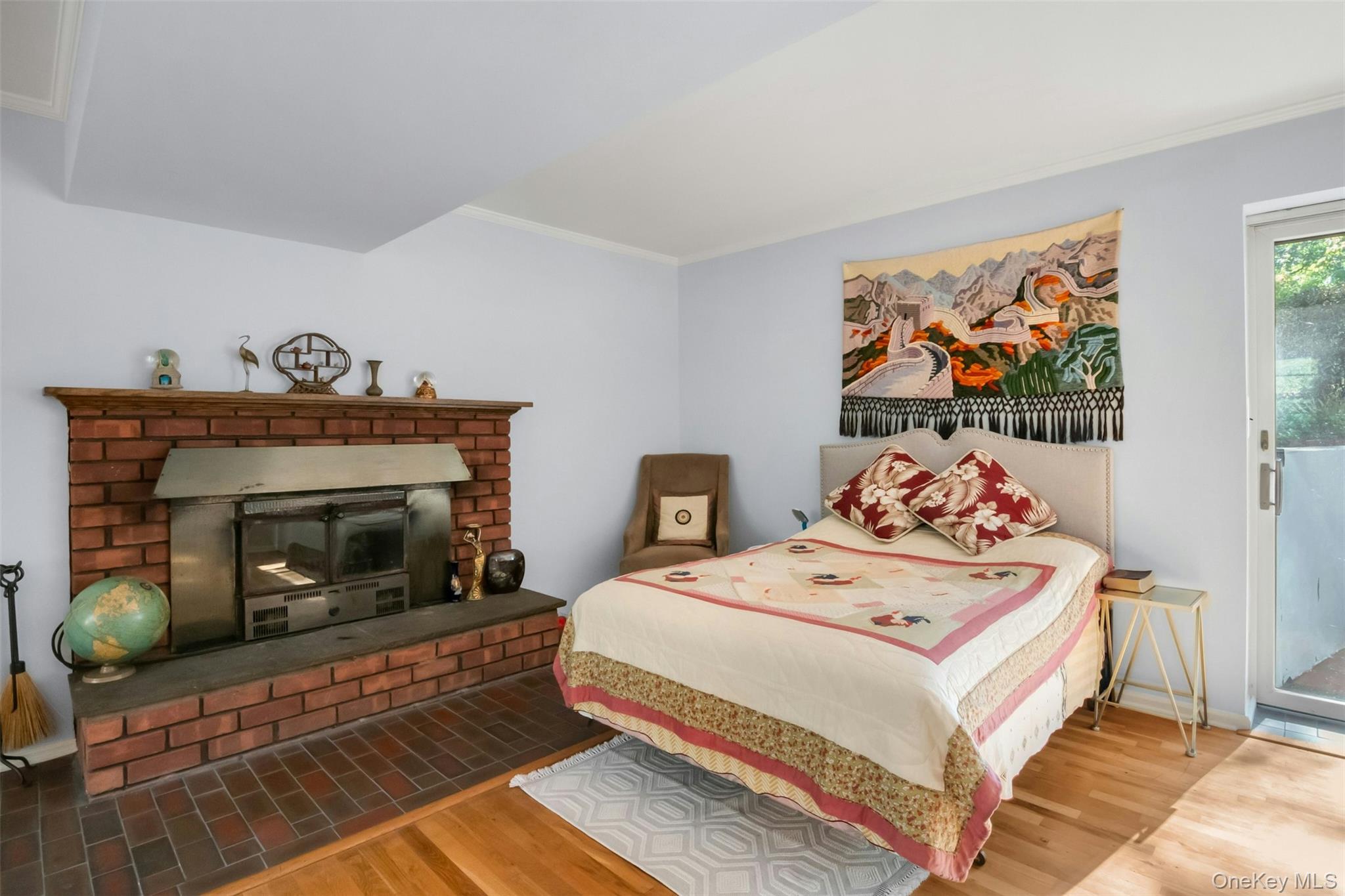 95 Emerson Avenue New Rochelle, NY 10801 - Photo 16 of 27 a bedroom with a bed and a fireplace