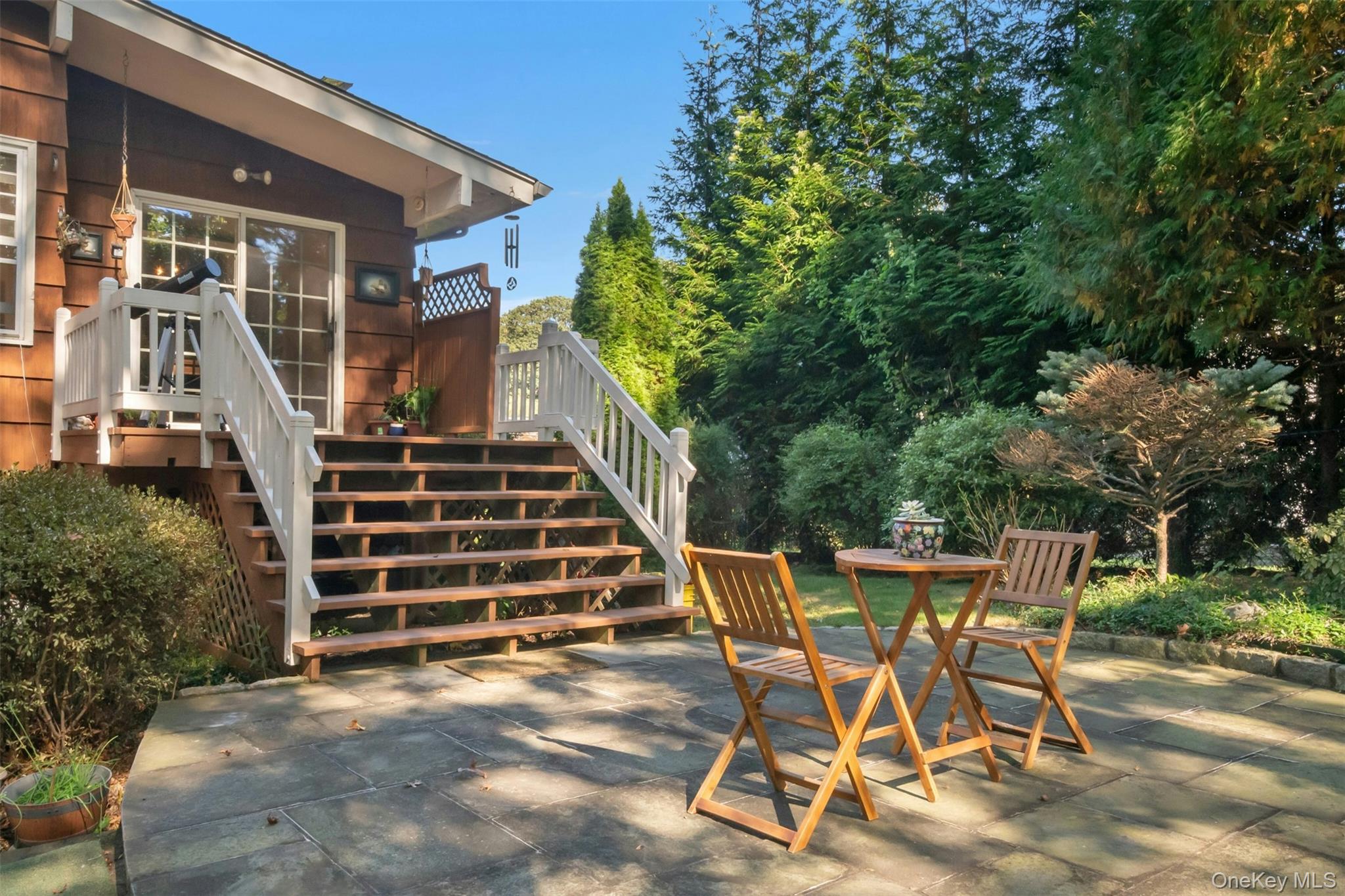 95 Emerson Avenue New Rochelle, NY 10801 - Photo 21 of 27 a view of a patio with table and chairs with wooden floor and fence