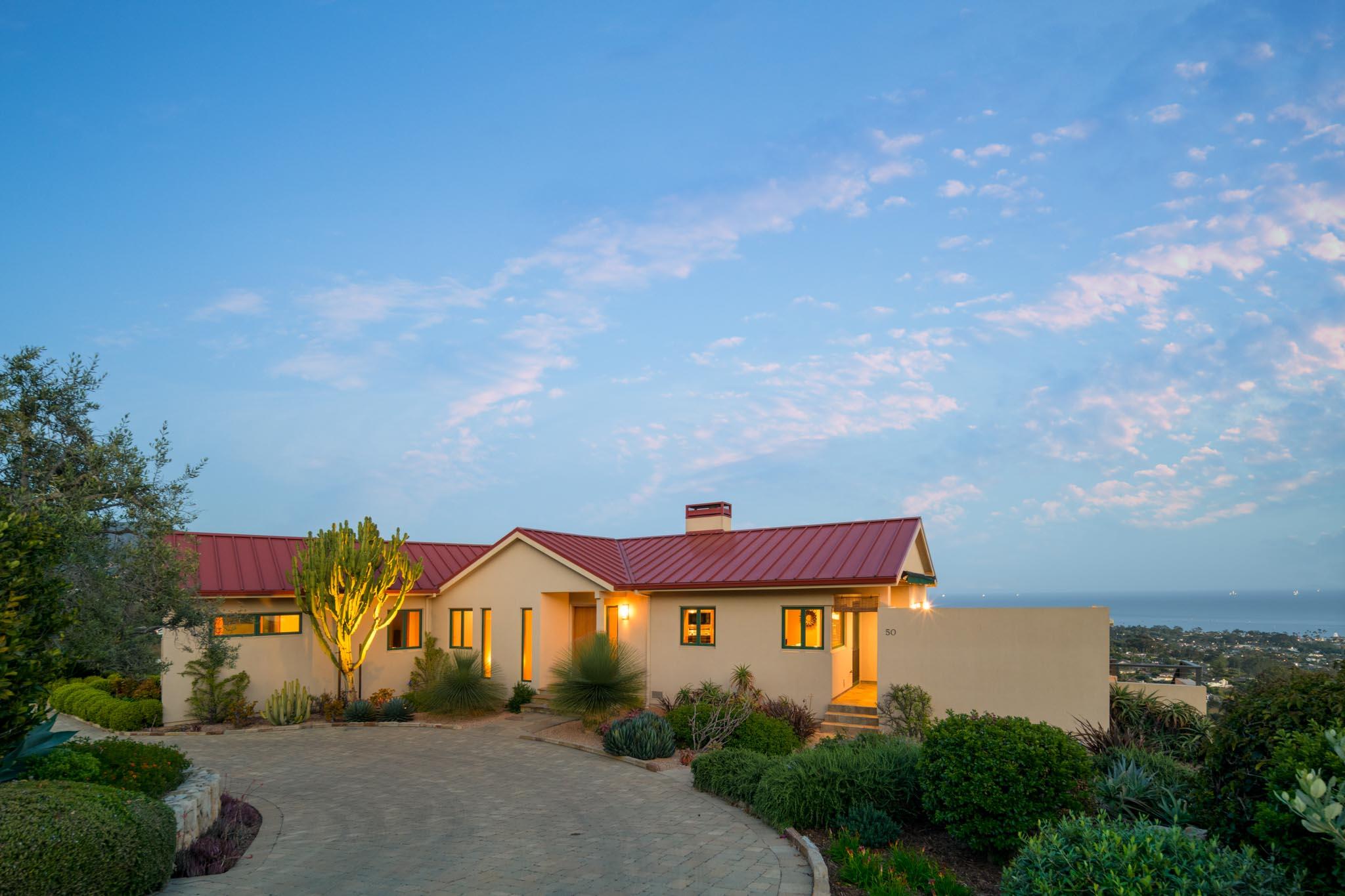 50 Rincon Vista Road Santa Barbara, CA 93103 - Photo 5 of 47 a front view of a house with a yard and garage