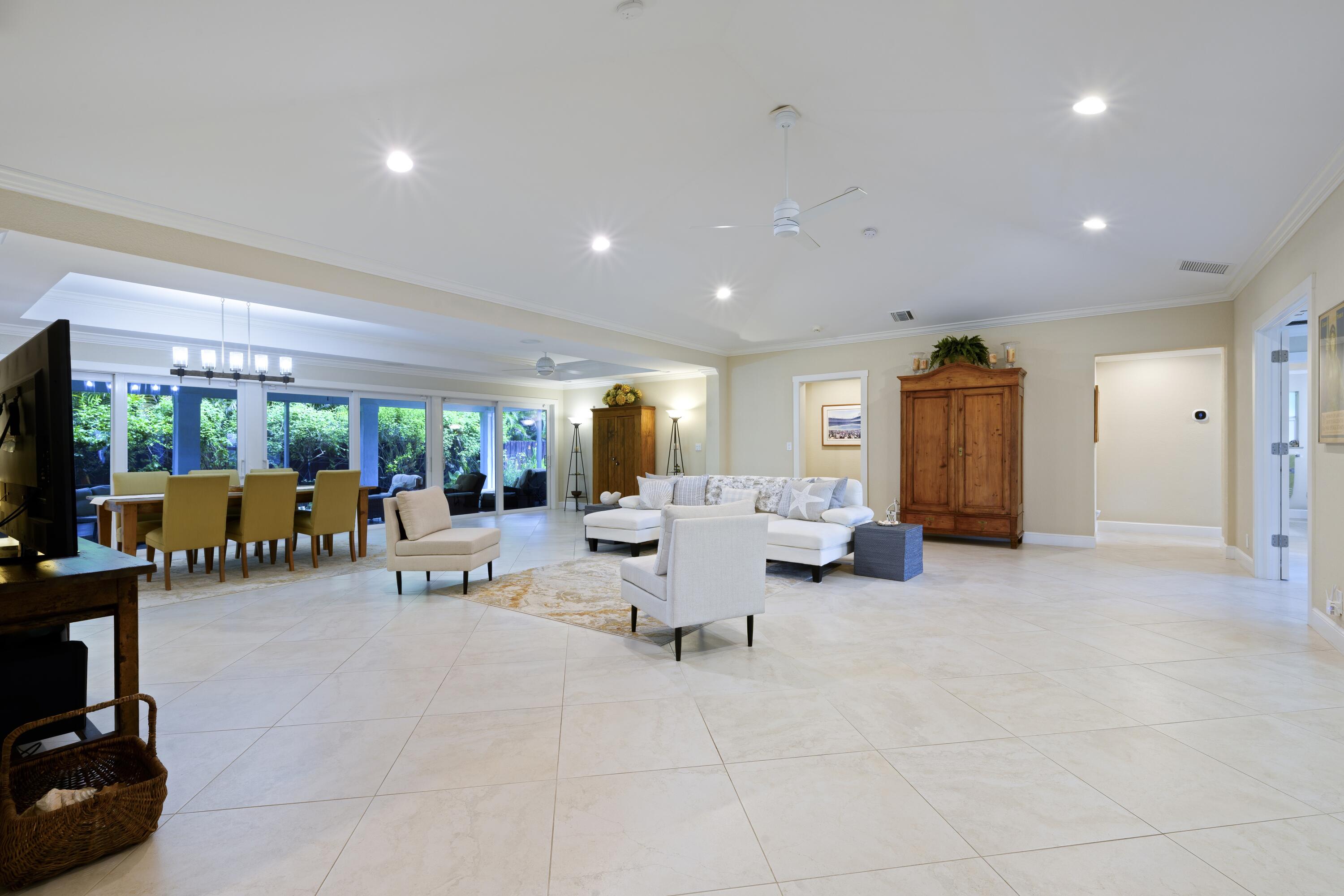 4535 Oak Tree Court Delray Beach, FL 33445 - Photo 12 of 43 a living room with furniture and a flat screen tv