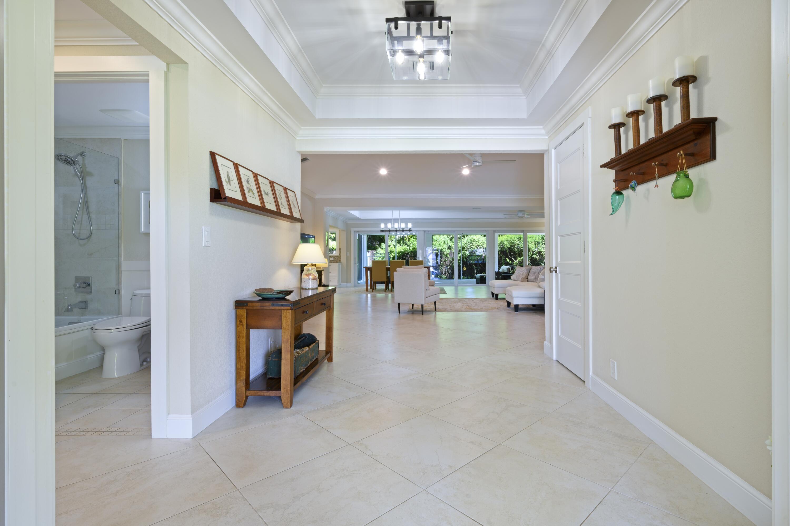 4535 Oak Tree Court Delray Beach, FL 33445 - Photo 18 of 43 a view of a hallway and dining room