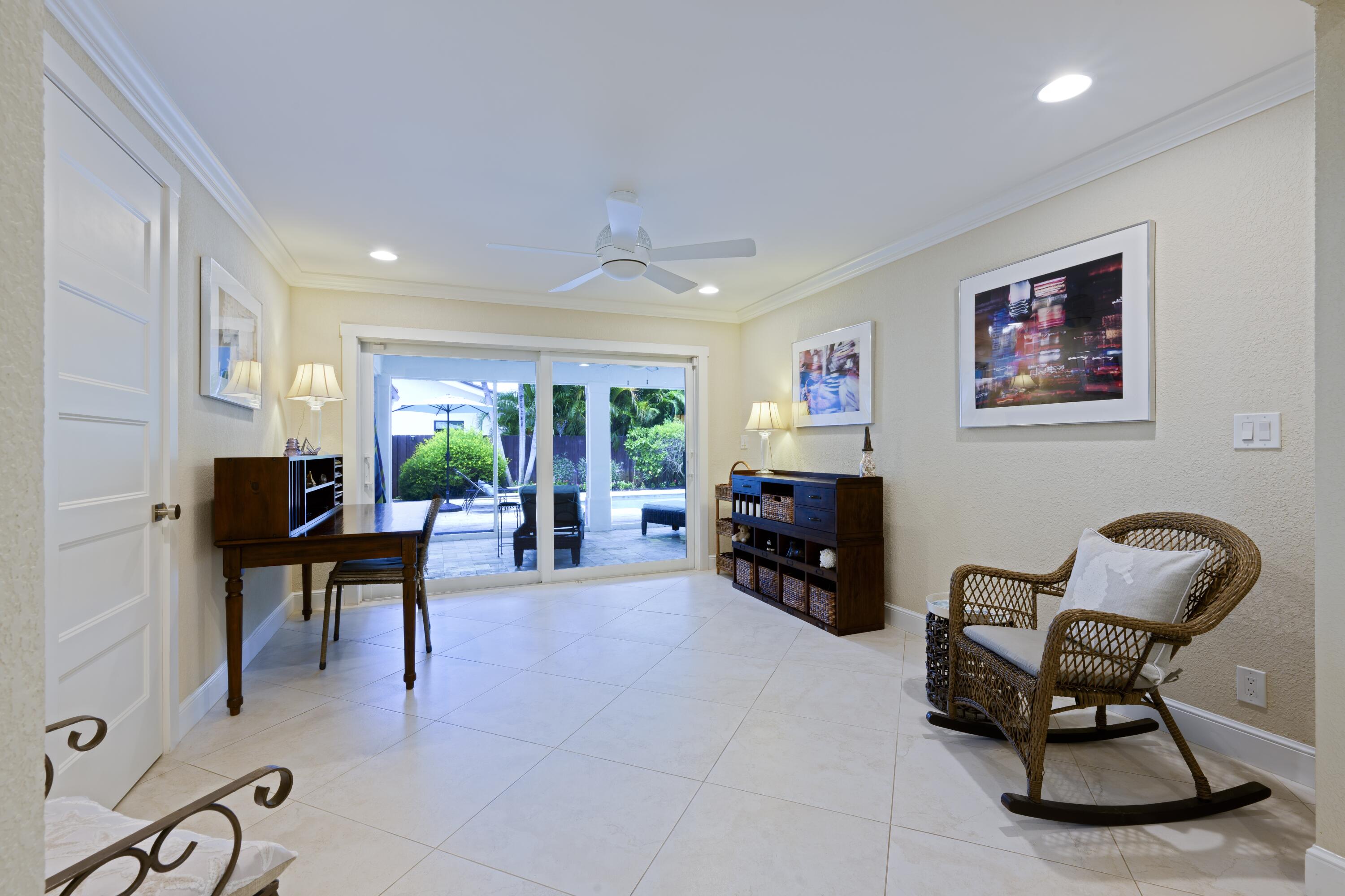 4535 Oak Tree Court Delray Beach, FL 33445 - Photo 19 of 43 a living room with furniture and a flat screen tv