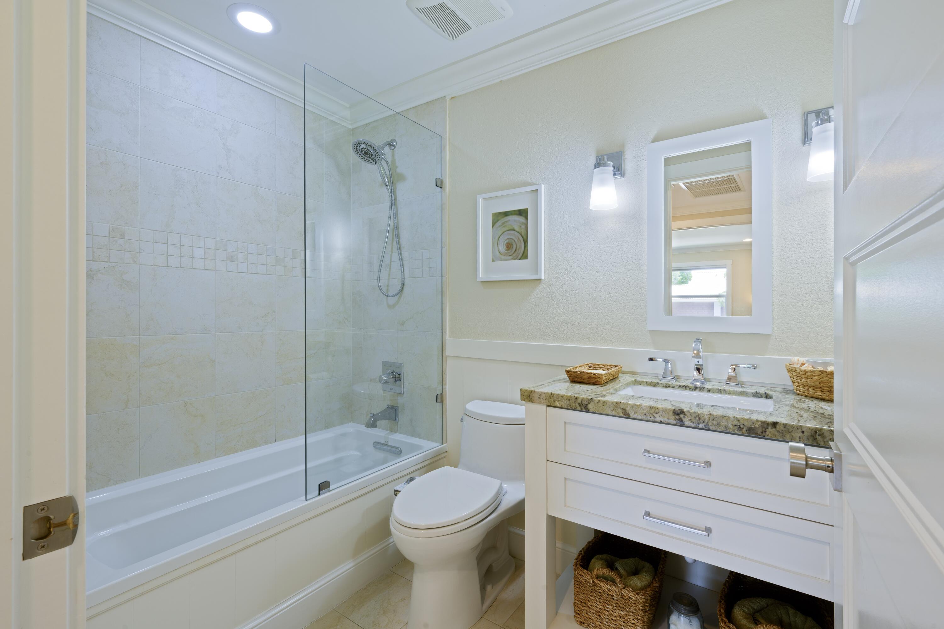 4535 Oak Tree Court Delray Beach, FL 33445 - Photo 29 of 43 a bathroom with a sink a toilet and shower