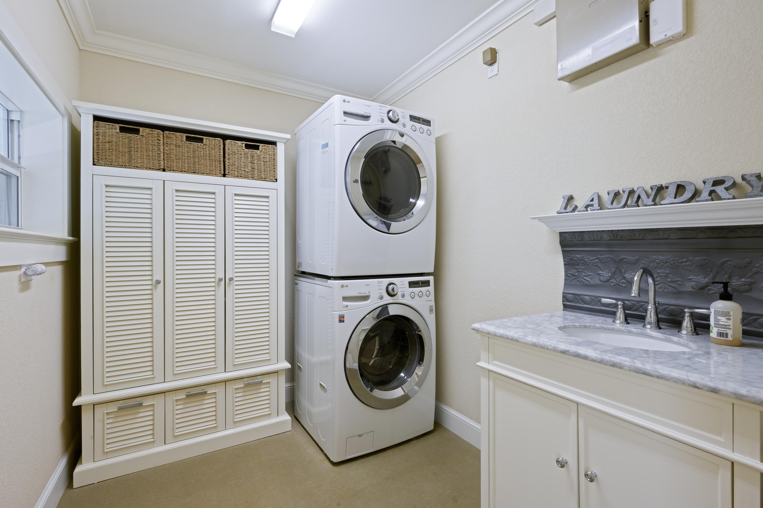 4535 Oak Tree Court Delray Beach, FL 33445 - Photo 30 of 43 a utility room with sink washer and dryer