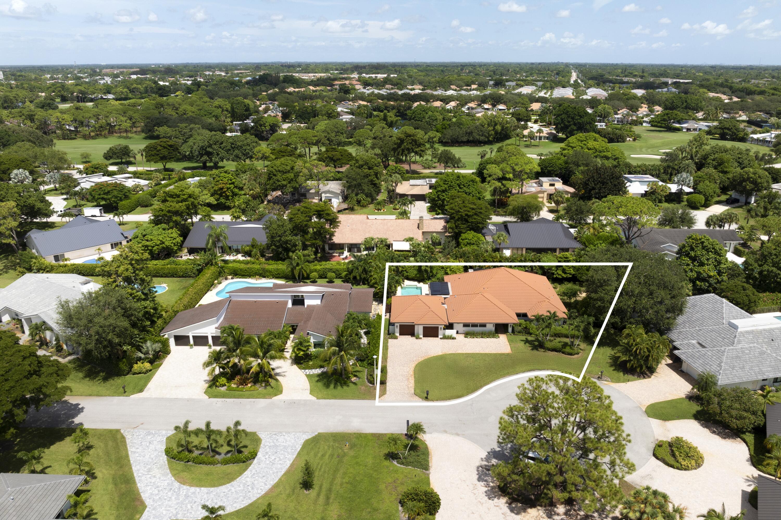 4535 Oak Tree Court Delray Beach, FL 33445 - Photo 3 of 43 an aerial view of a house