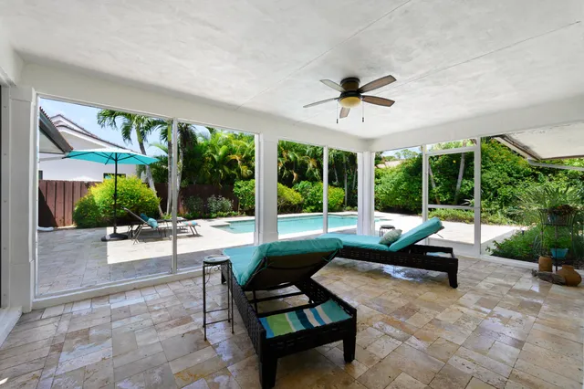 a building outdoor space with patio furniture and garden