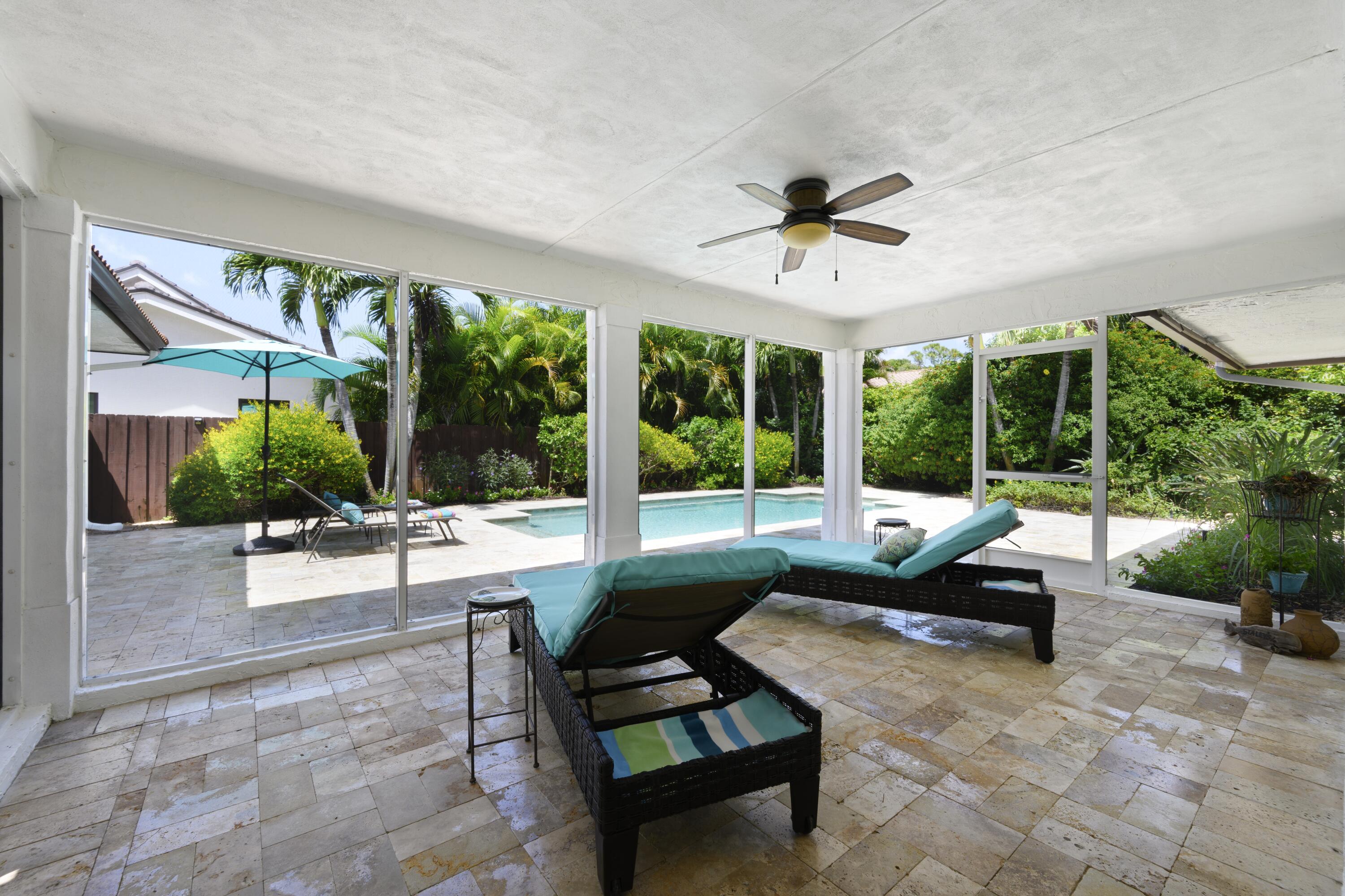 4535 Oak Tree Court Delray Beach, FL 33445 - Photo 34 of 43 a building outdoor space with patio furniture and garden