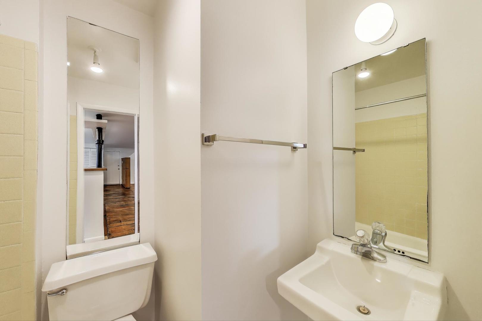 1906-1908 South Halsted Street, Unit 2R Chicago, IL 60608 - Photo 13 of 23 a bathroom with a sink toilet and shower