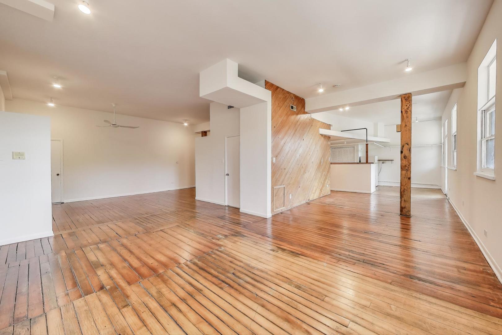 1906-1908 South Halsted Street, Unit 2R Chicago, IL 60608 - Photo 15 of 23 a view of empty room with wooden floor
