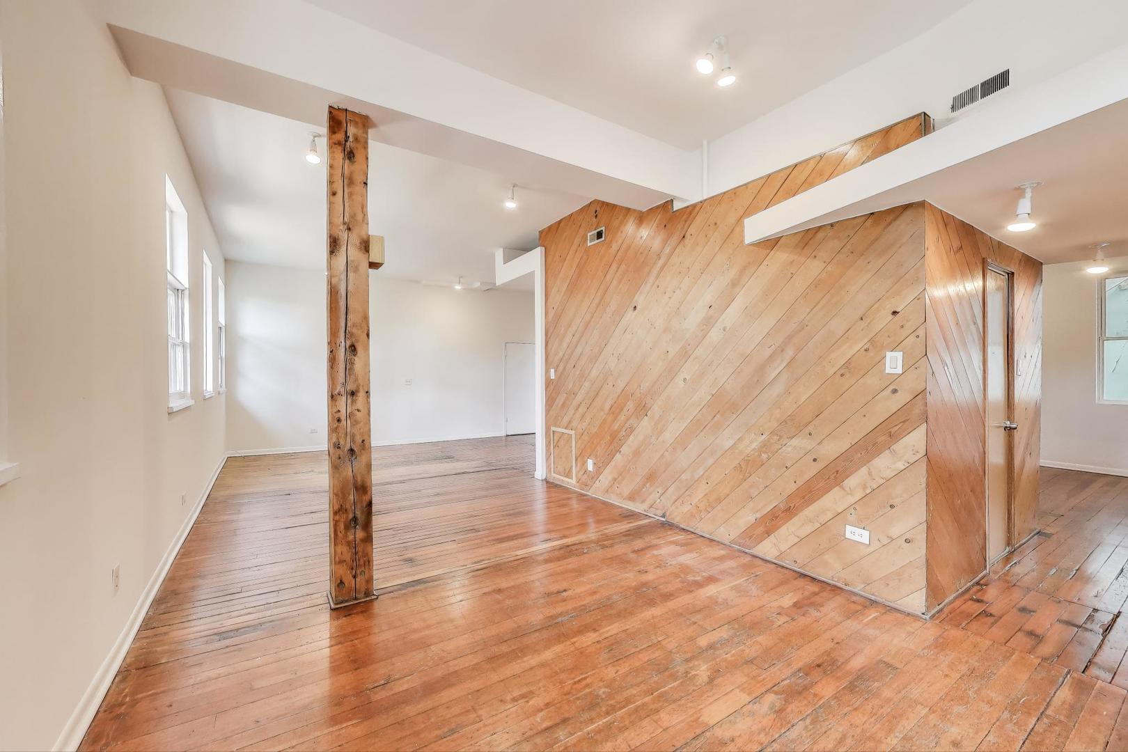 1906-1908 South Halsted Street, Unit 2R Chicago, IL 60608 - Photo 16 of 23 a view of a hallway with wooden floor
