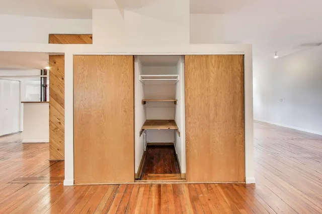 a bathroom with a sink mirror and toilet