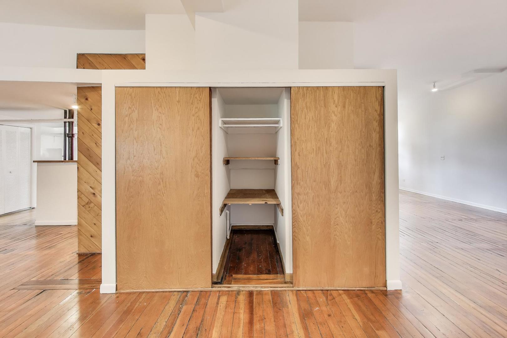 1906-1908 South Halsted Street, Unit 2R Chicago, IL 60608 - Photo 19 of 23 a view of a room with wooden floor staircase and a hallway