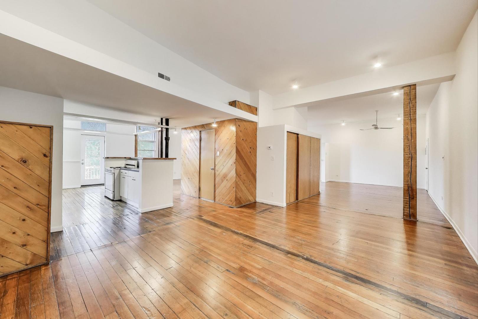 1906-1908 South Halsted Street, Unit 2R Chicago, IL 60608 - Photo 6 of 23 a view of empty room with wooden floor