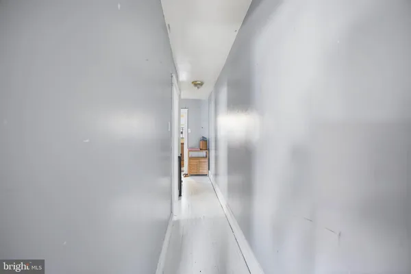 a view of a hallway with a white walls