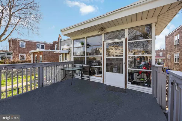 a view of a deck with a table and chairs