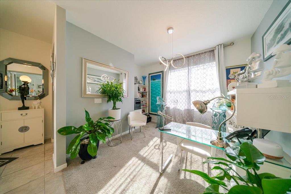 1833 Spring Shower Circle Kissimmee, FL 34744 - Photo 11 of 51 a living room with furniture potted plant and windows
