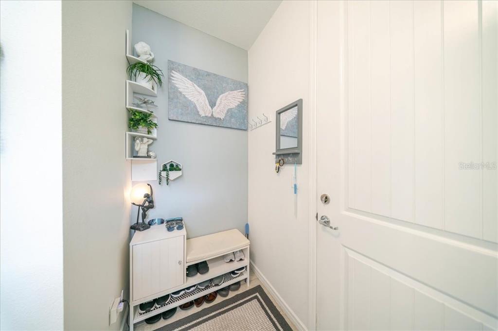 1833 Spring Shower Circle Kissimmee, FL 34744 - Photo 17 of 51 a room with a potted plant and a shower curtain