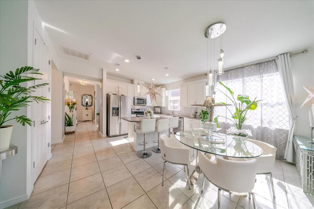1833 Spring Shower Circle Kissimmee, FL 34744 - Photo 20 of 51 a view of a dining room with furniture