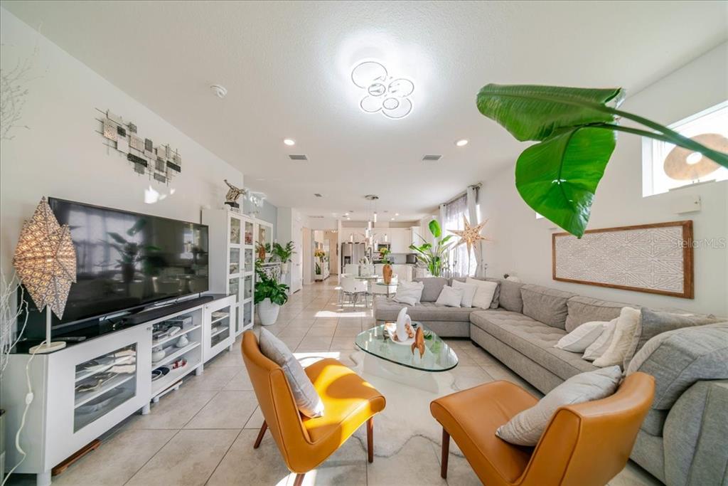 1833 Spring Shower Circle Kissimmee, FL 34744 - Photo 27 of 51 a living room with furniture and a flat screen tv