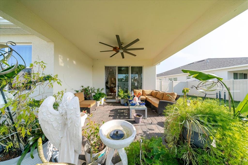 1833 Spring Shower Circle Kissimmee, FL 34744 - Photo 33 of 51 a view of a dining room with furniture and floor to ceiling window