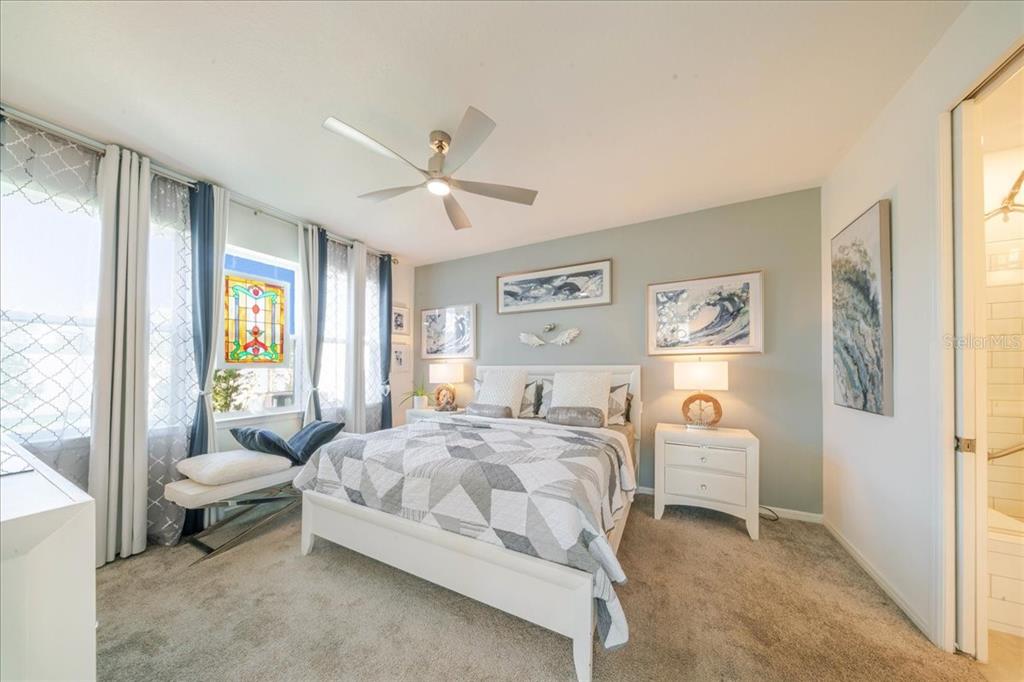 1833 Spring Shower Circle Kissimmee, FL 34744 - Photo 38 of 51 a spacious bedroom with a bed and a window