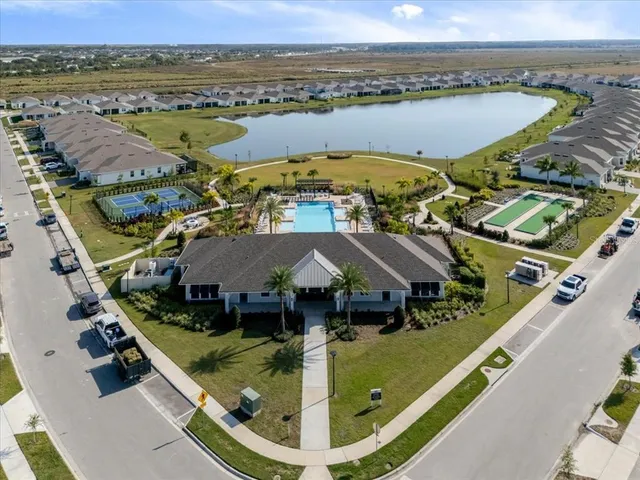 an aerial view of a house with a swimming pool