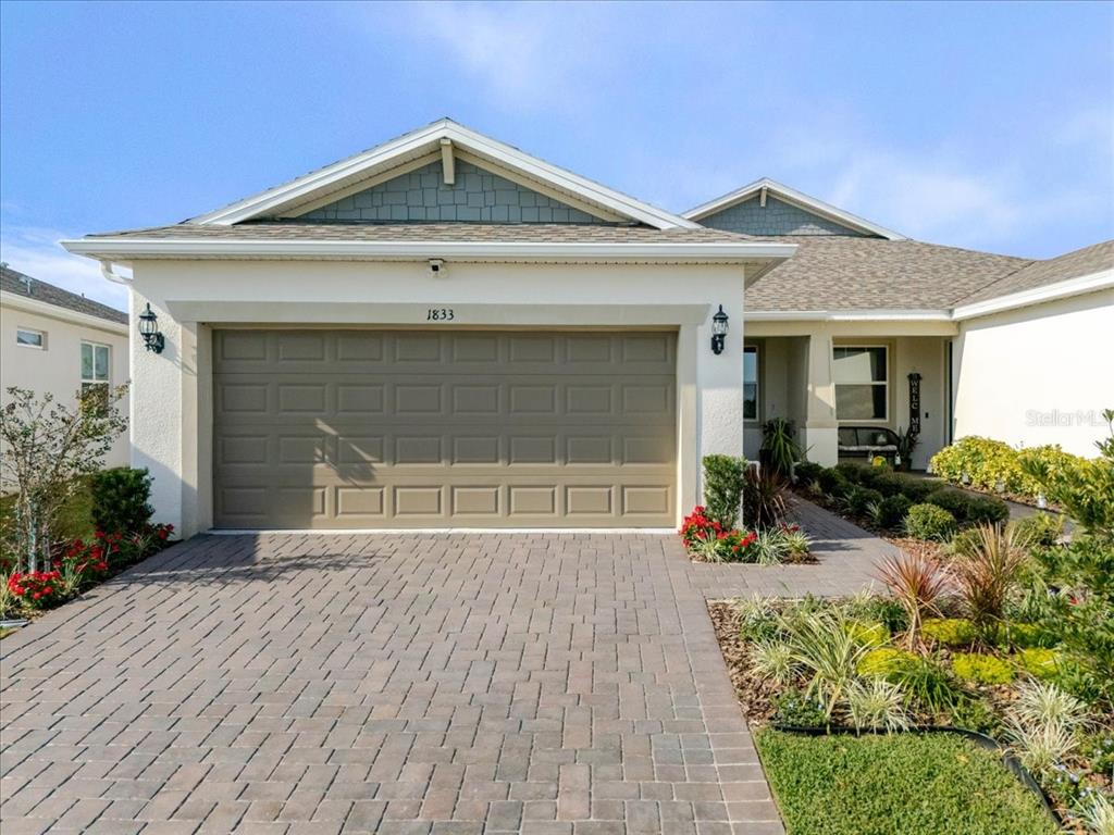 1833 Spring Shower Circle Kissimmee, FL 34744 - Photo 7 of 51 a front view of a house with a yard