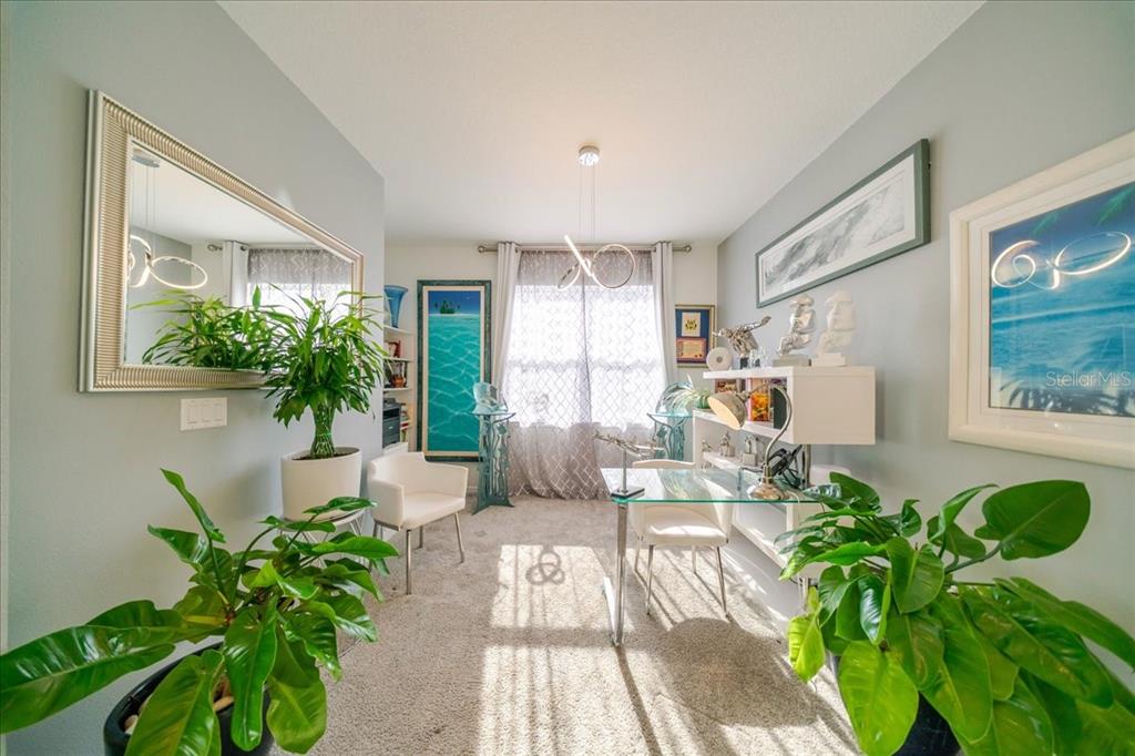 1833 Spring Shower Circle Kissimmee, FL 34744 - Photo 10 of 51 a living room with furniture and a potted plant