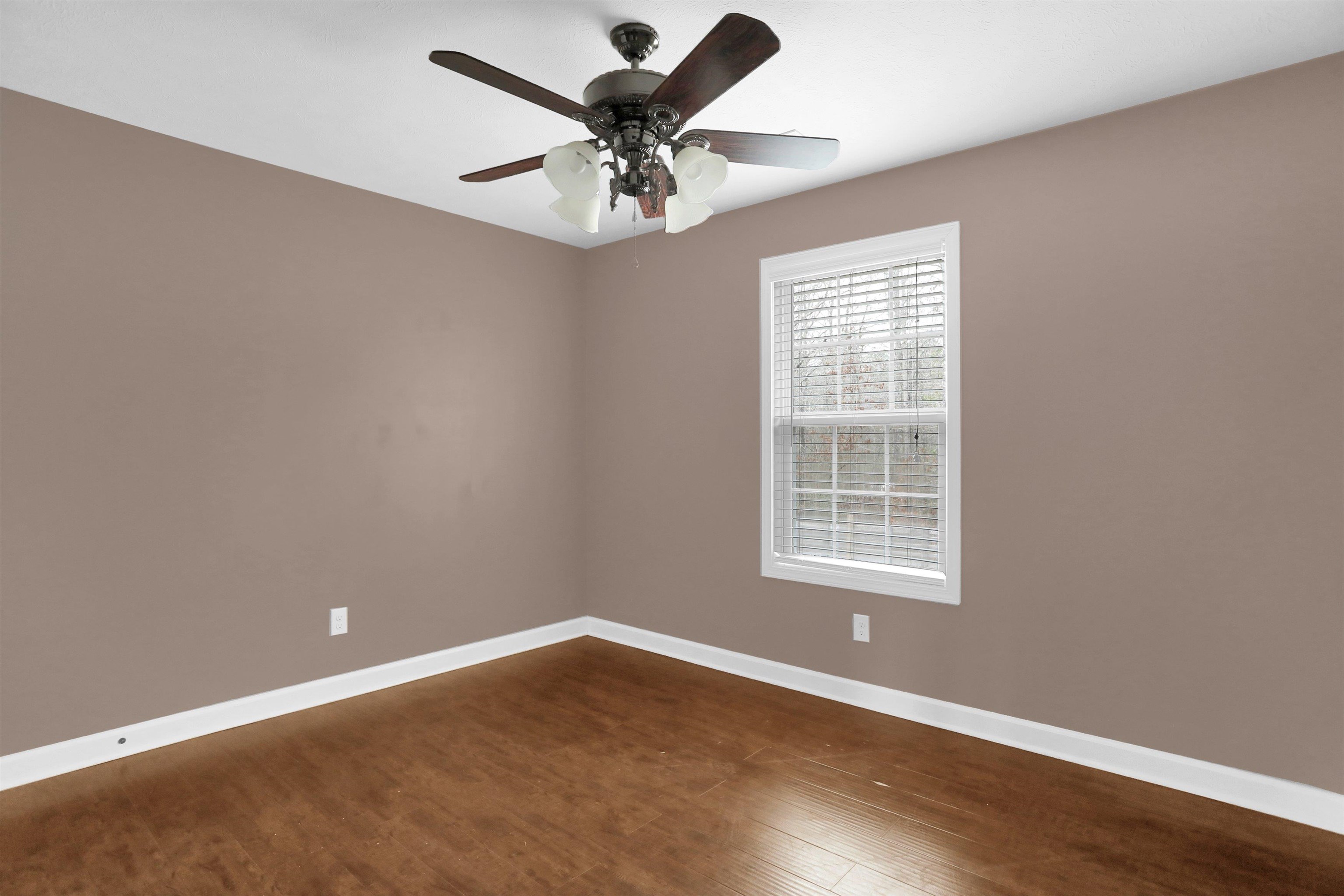 186 King Road Selmer, TN 38375 - Photo 10 of 30 an empty room with a window and a fan