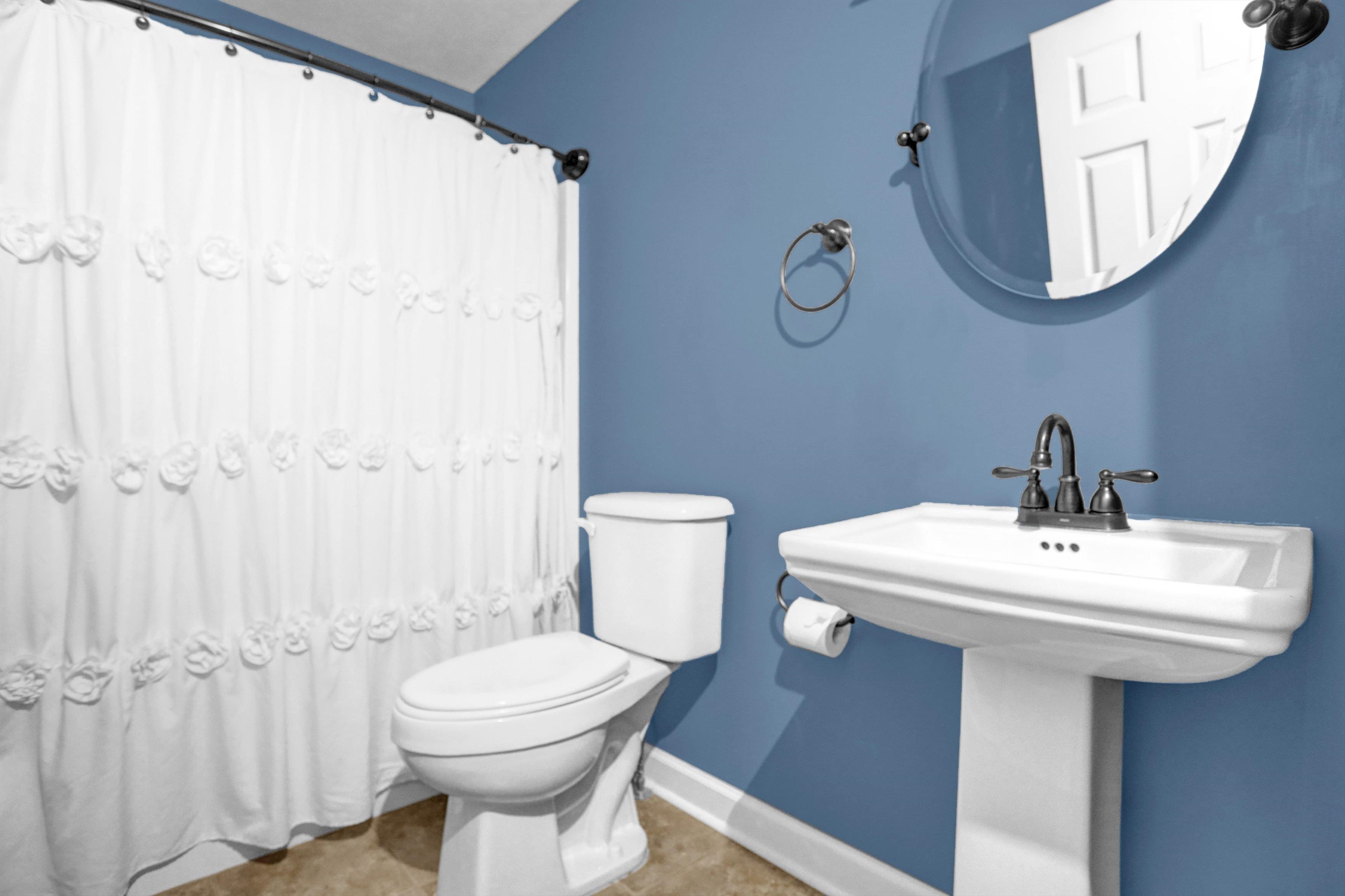 186 King Road Selmer, TN 38375 - Photo 12 of 30 a bathroom with a sink a toilet and mirror