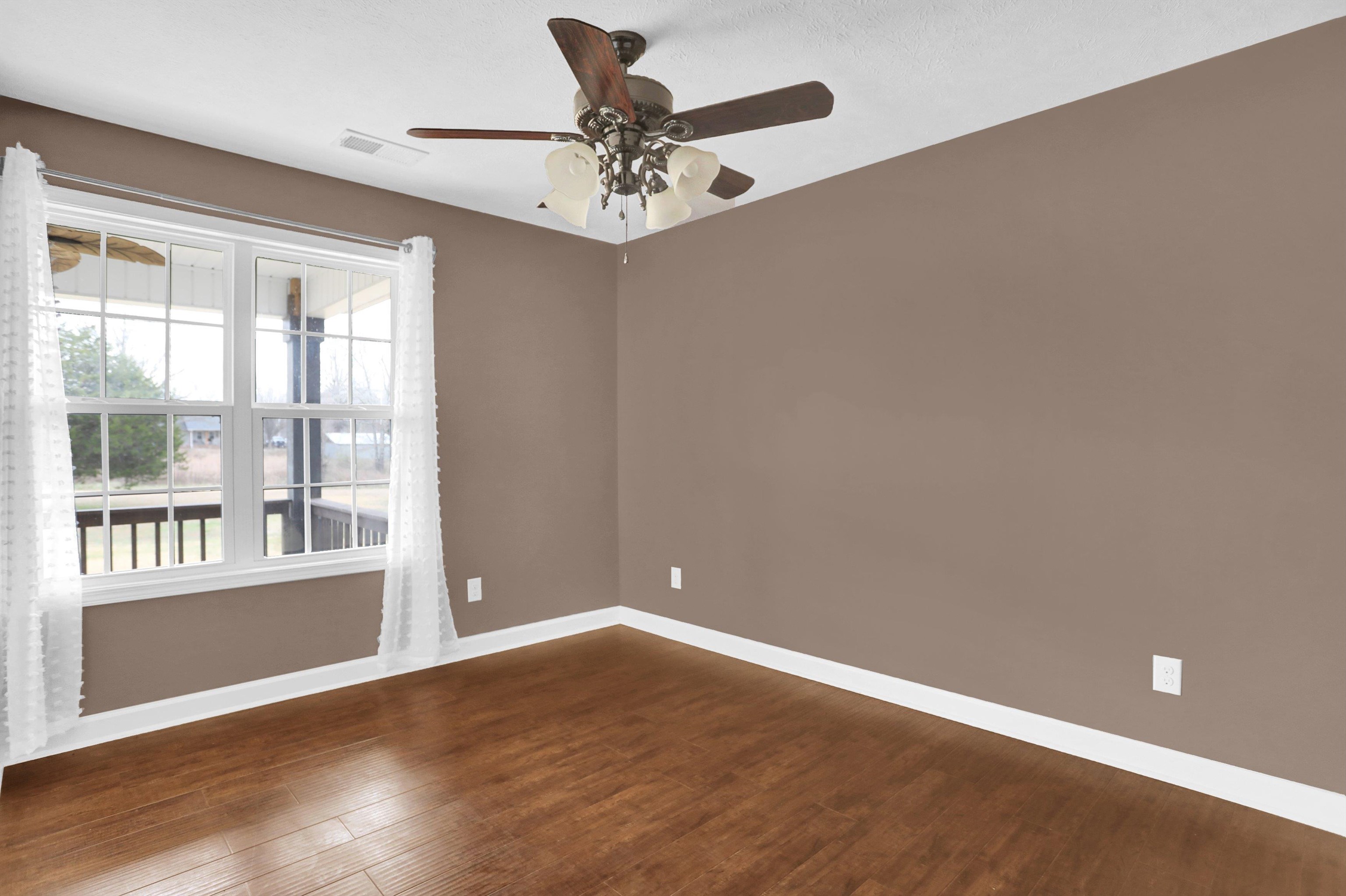 186 King Road Selmer, TN 38375 - Photo 13 of 30 wooden floor in an empty room with a window