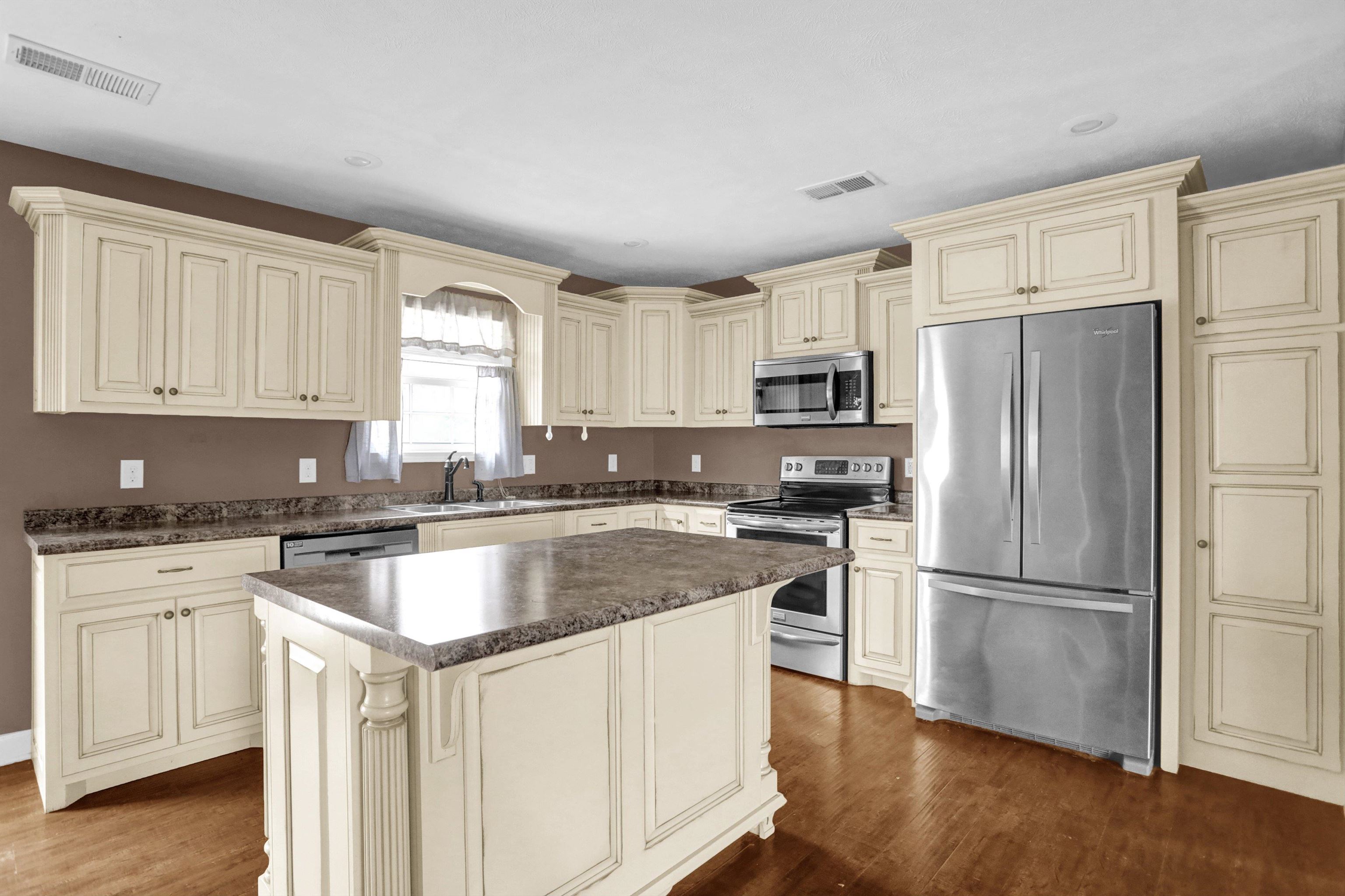 186 King Road Selmer, TN 38375 - Photo 16 of 30 a kitchen with a refrigerator stove and microwave