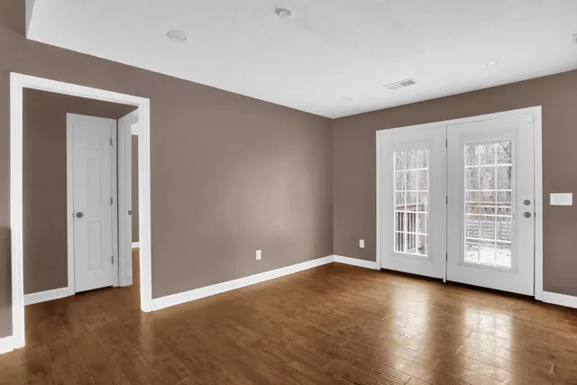a view of an empty room with a window