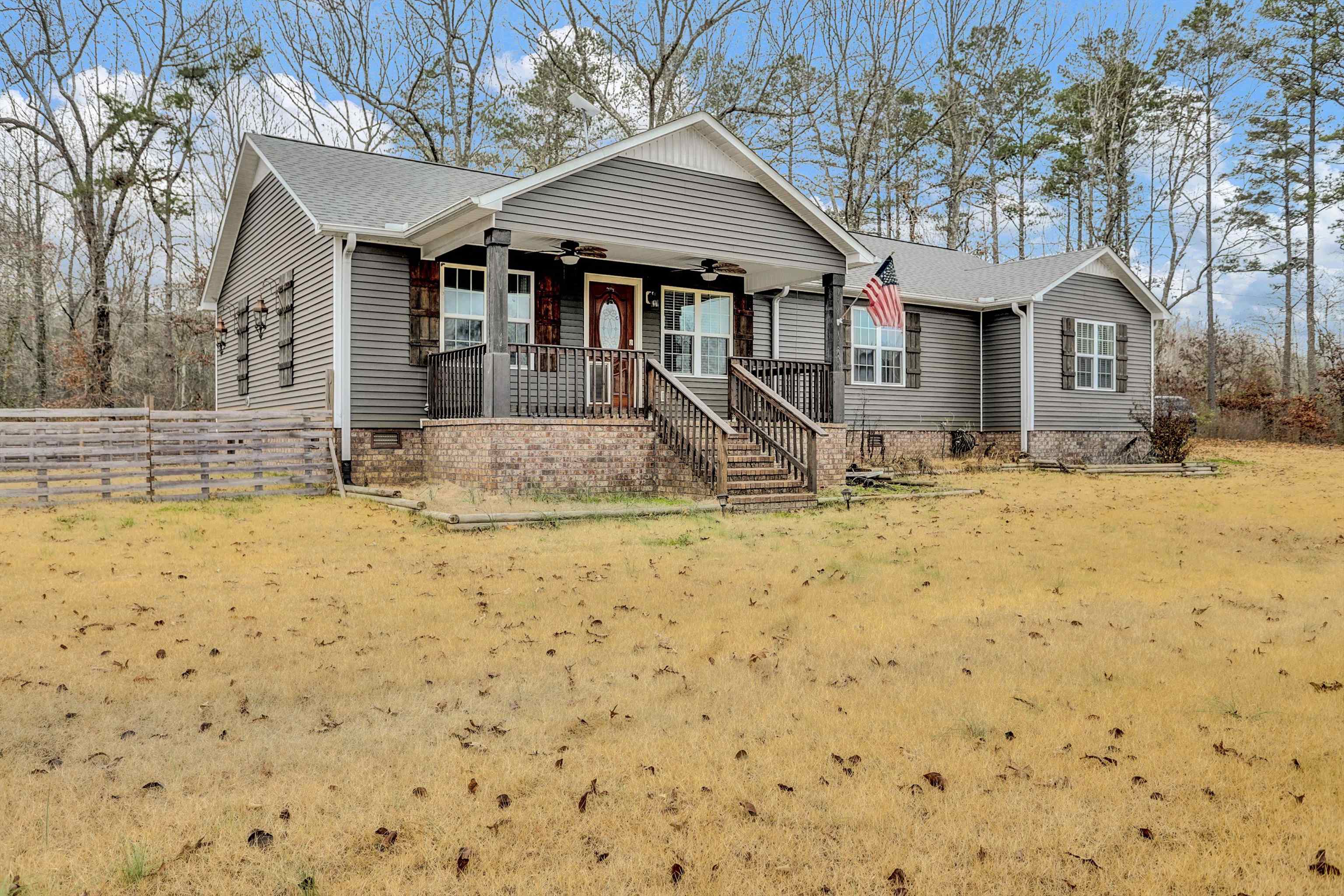 186 King Road Selmer, TN 38375 - Photo 2 of 30 a view of wooden house with large trees