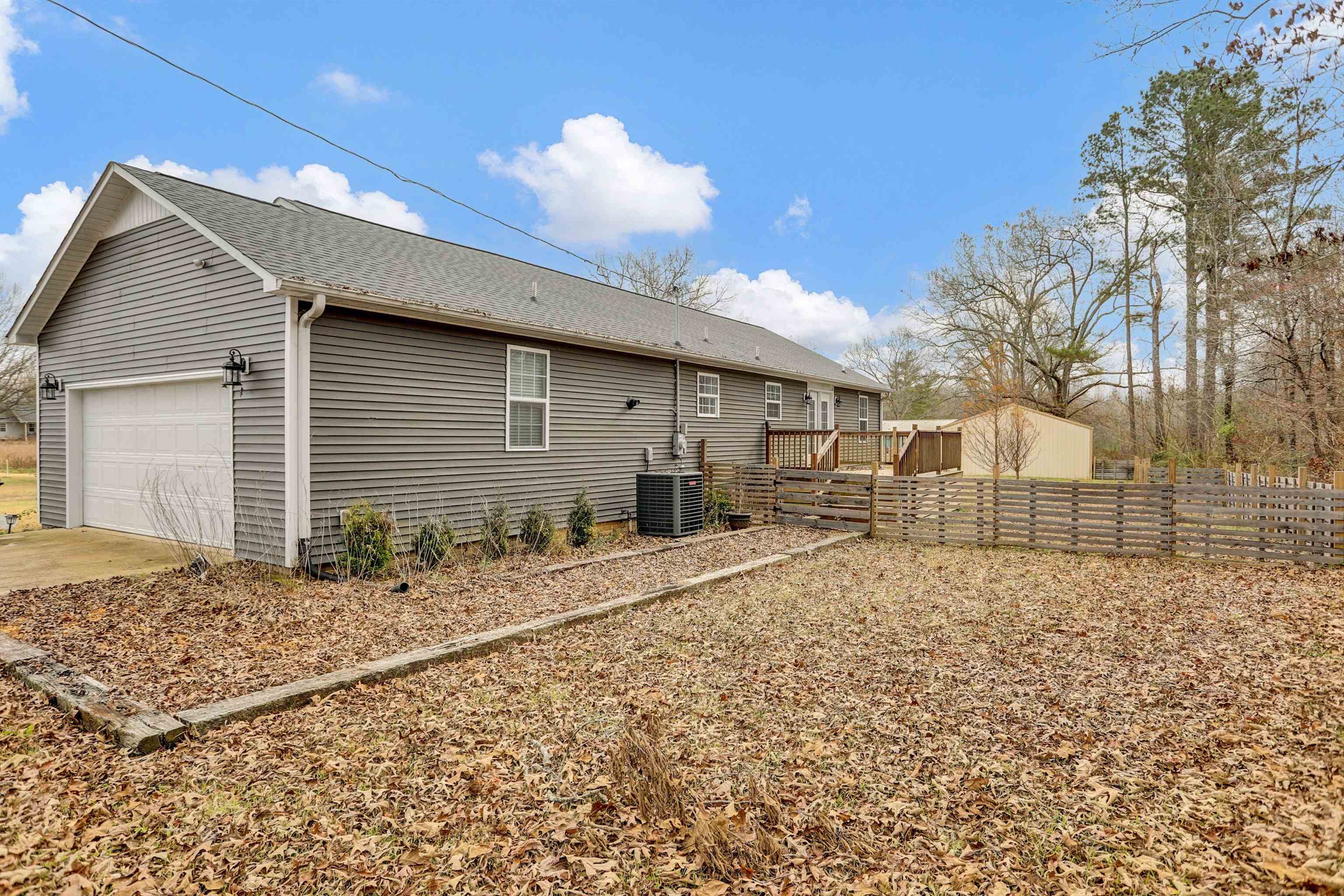 186 King Road Selmer, TN 38375 - Photo 25 of 30 a backyard of a house with large trees