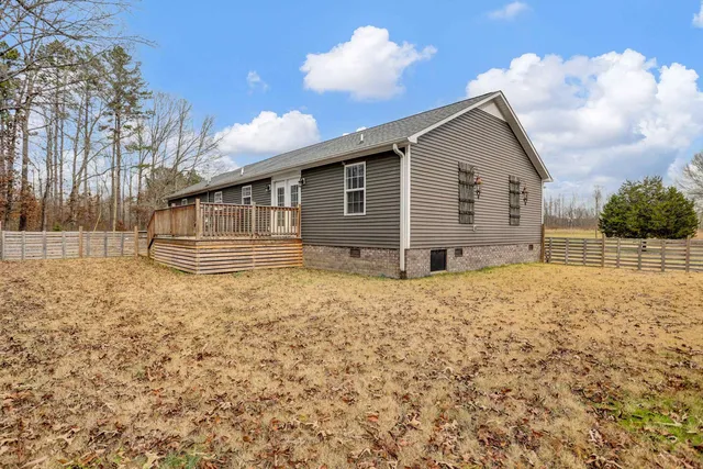 a backyard of a house with large trees