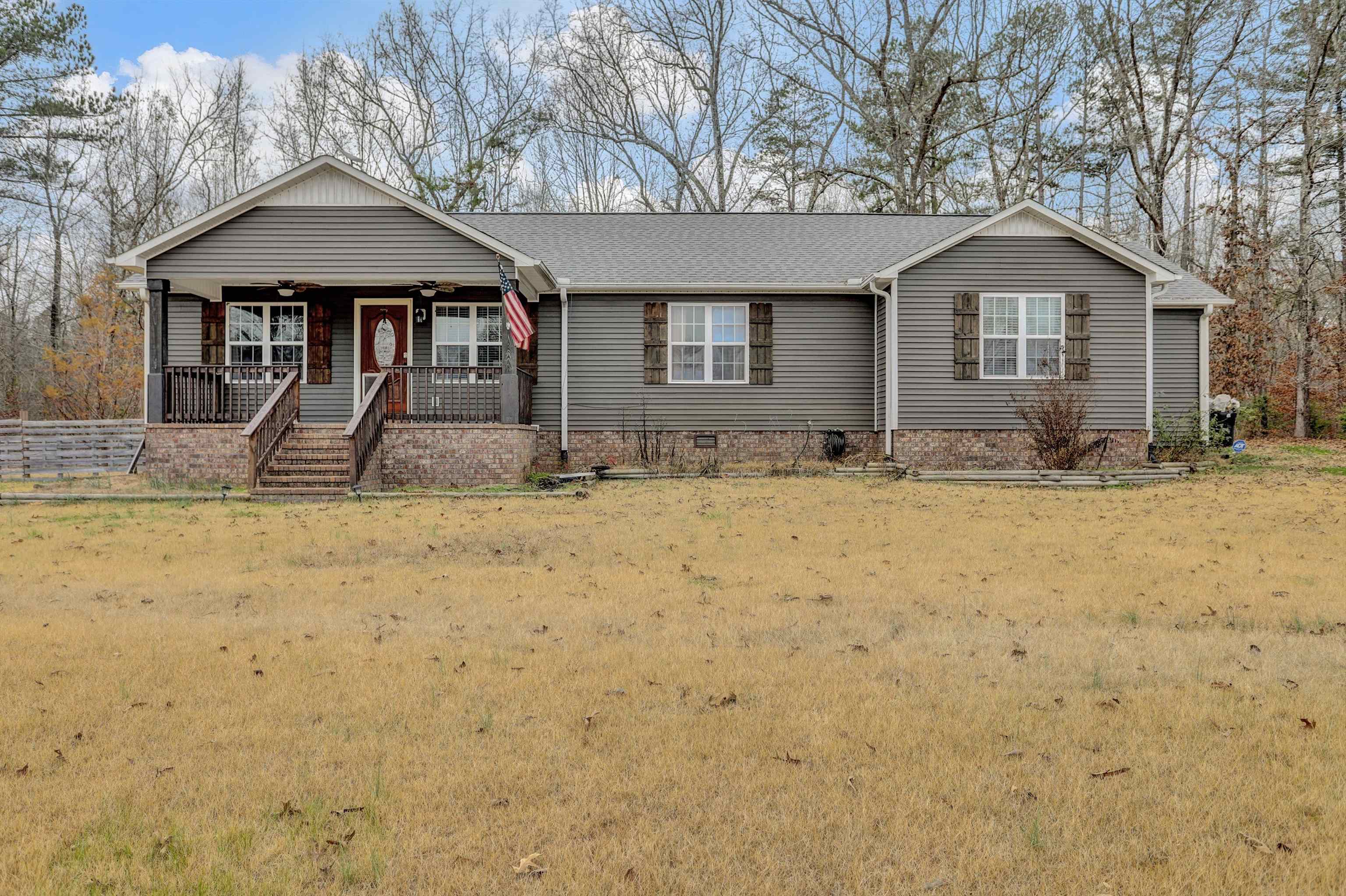 186 King Road Selmer, TN 38375 - Photo 3 of 30 a front view of a house with a yard