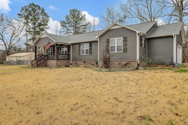 a view of house with yard