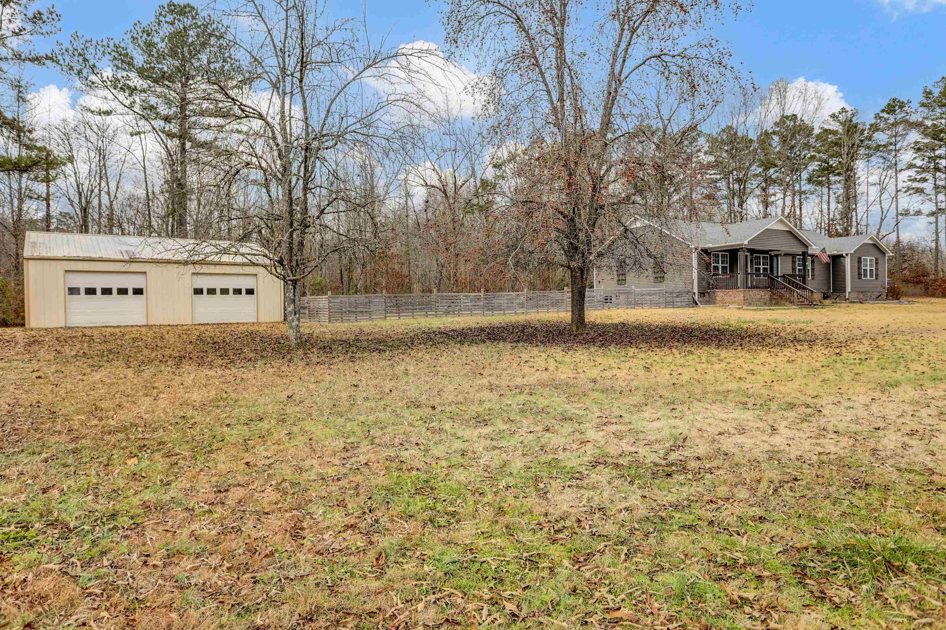 186 King Road Selmer, TN 38375 - Photo 5 of 30 a front view of a house with a yard