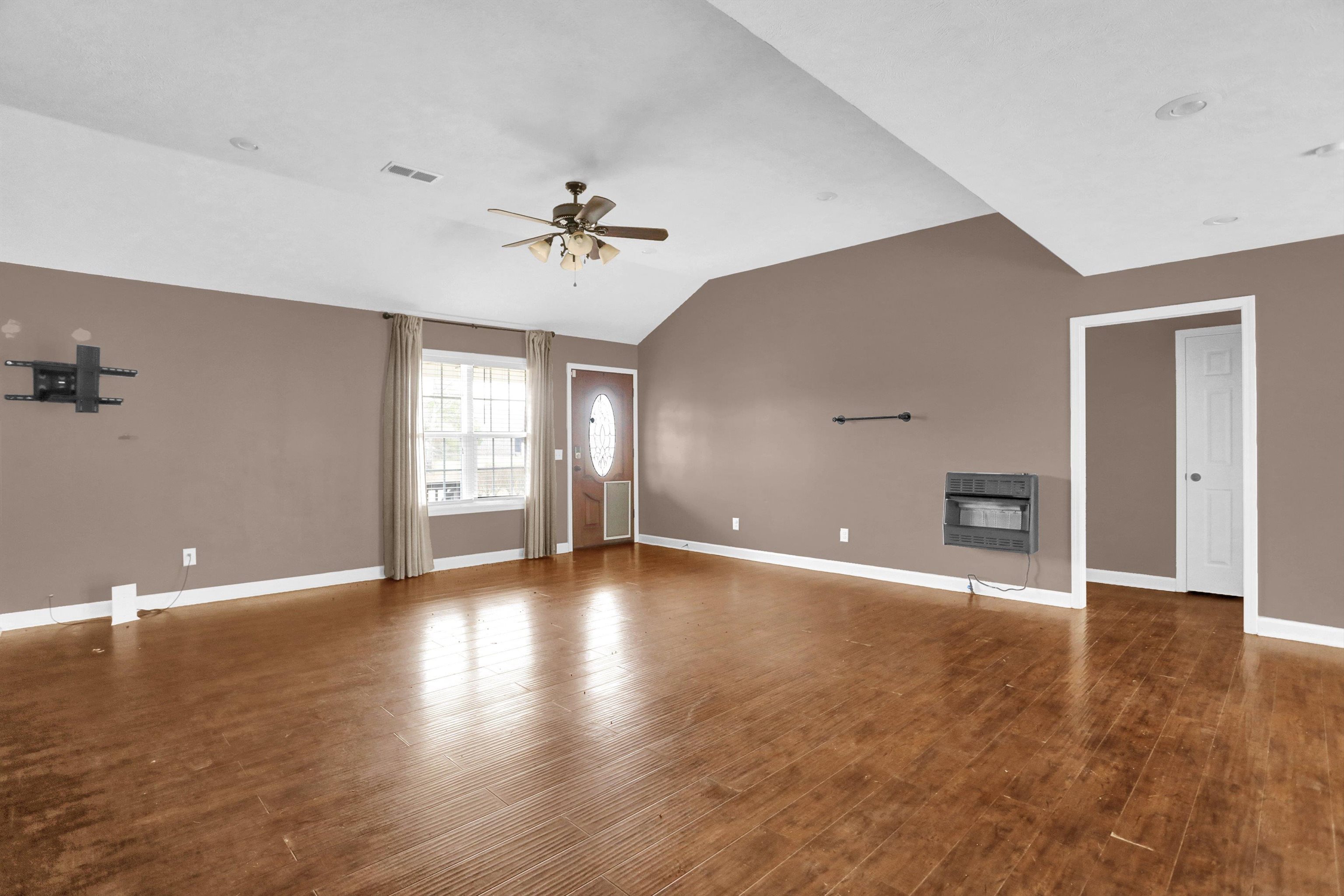 186 King Road Selmer, TN 38375 - Photo 8 of 30 a view of an empty room with window and wooden floor