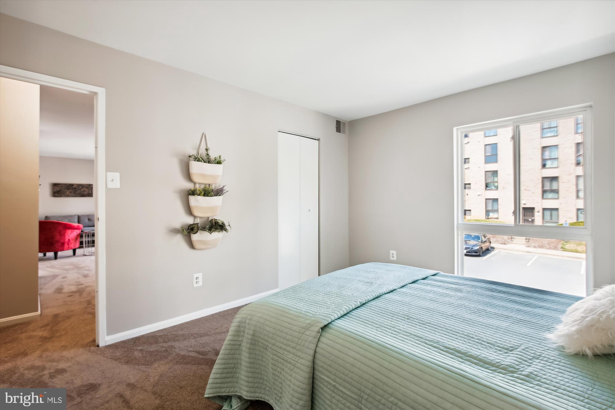 6143 Edsall Road, Unit H Alexandria, VA 22304 - Photo 12 of 18 a bedroom with a bed and a window