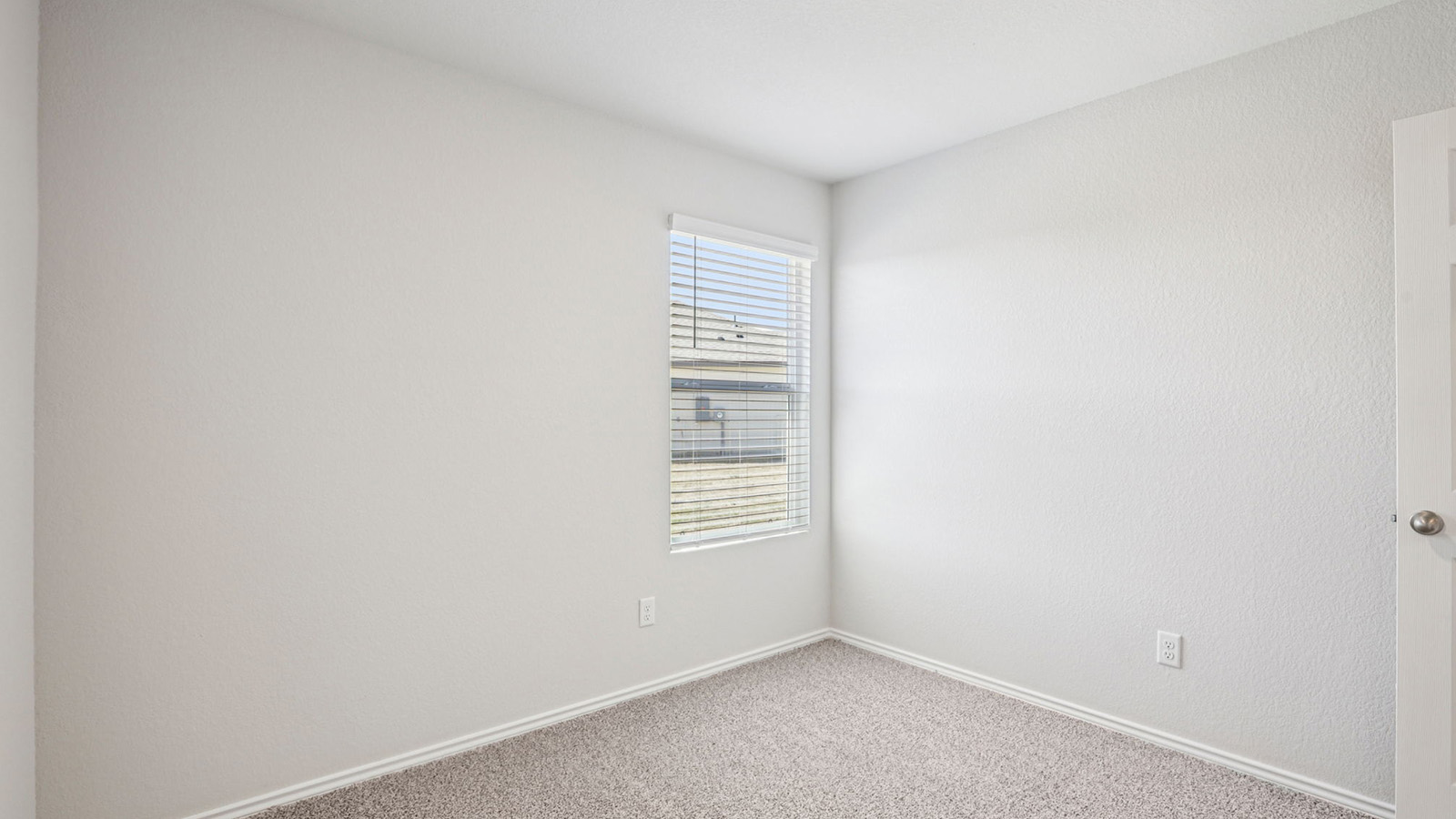 148 Wyatt Way Jarrell, TX 76537 - Photo 23 of 33 Carpeted room with a single window featuring horizontal blinds