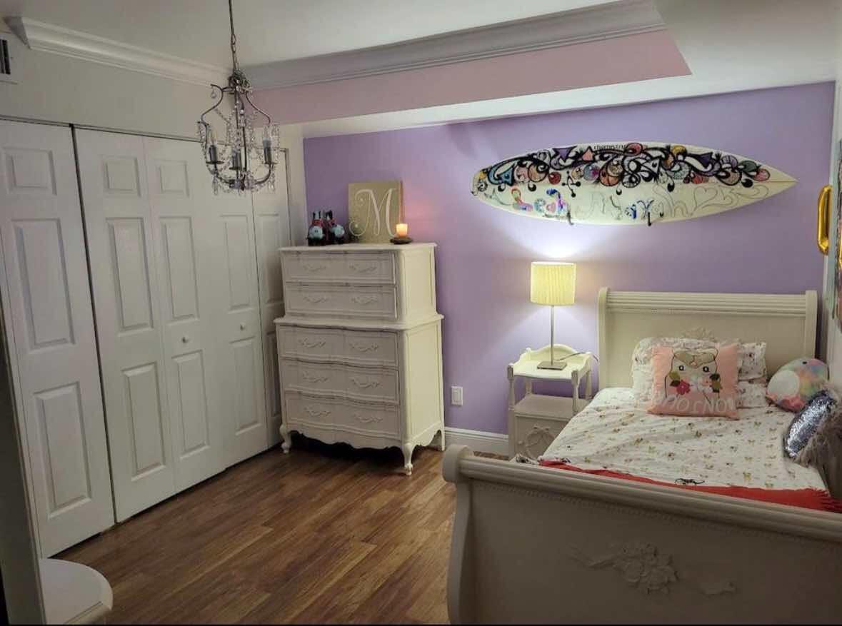 8282 Boca Rio Drive Boca Raton, FL 33433 - Photo 17 of 29 a bedroom with a bed and wooden floor