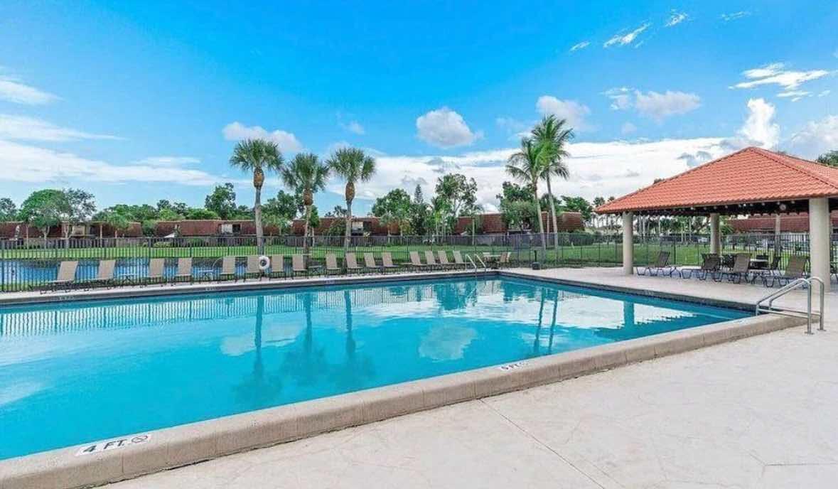 8282 Boca Rio Drive Boca Raton, FL 33433 - Photo 24 of 29 a view of a swimming pool and outdoor space