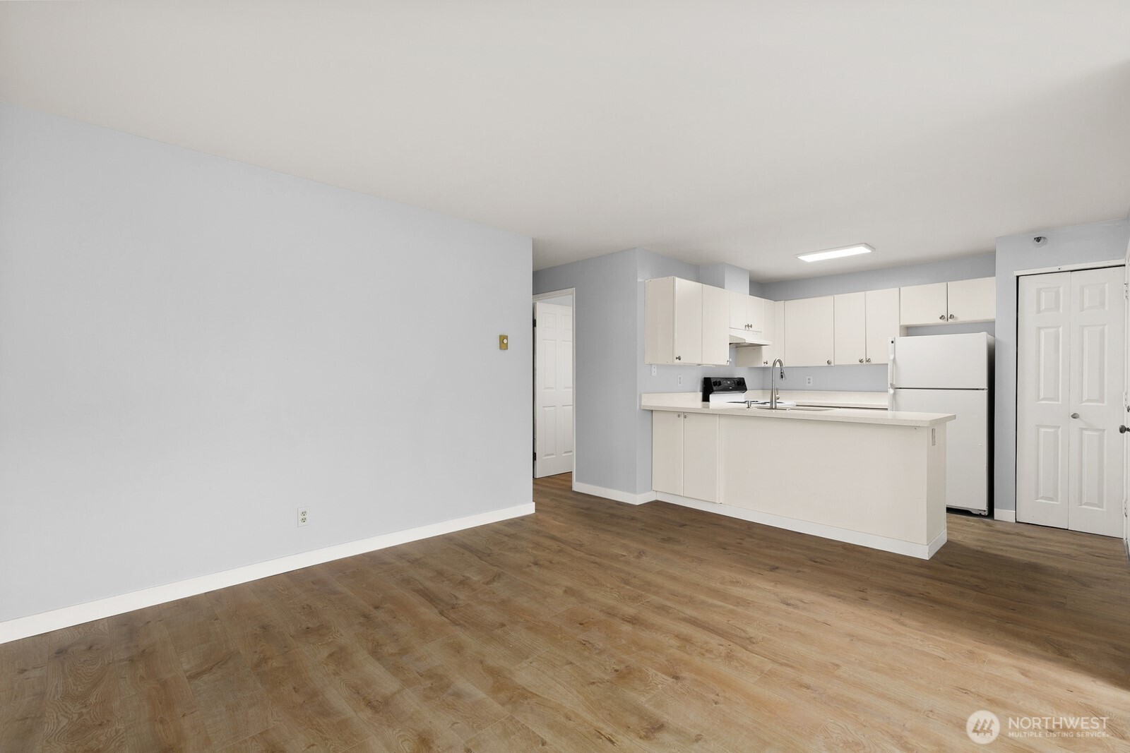 3660 Whitman Avenue North Seattle, WA 98103 - Photo 12 of 40 a view of kitchen with wooden floor