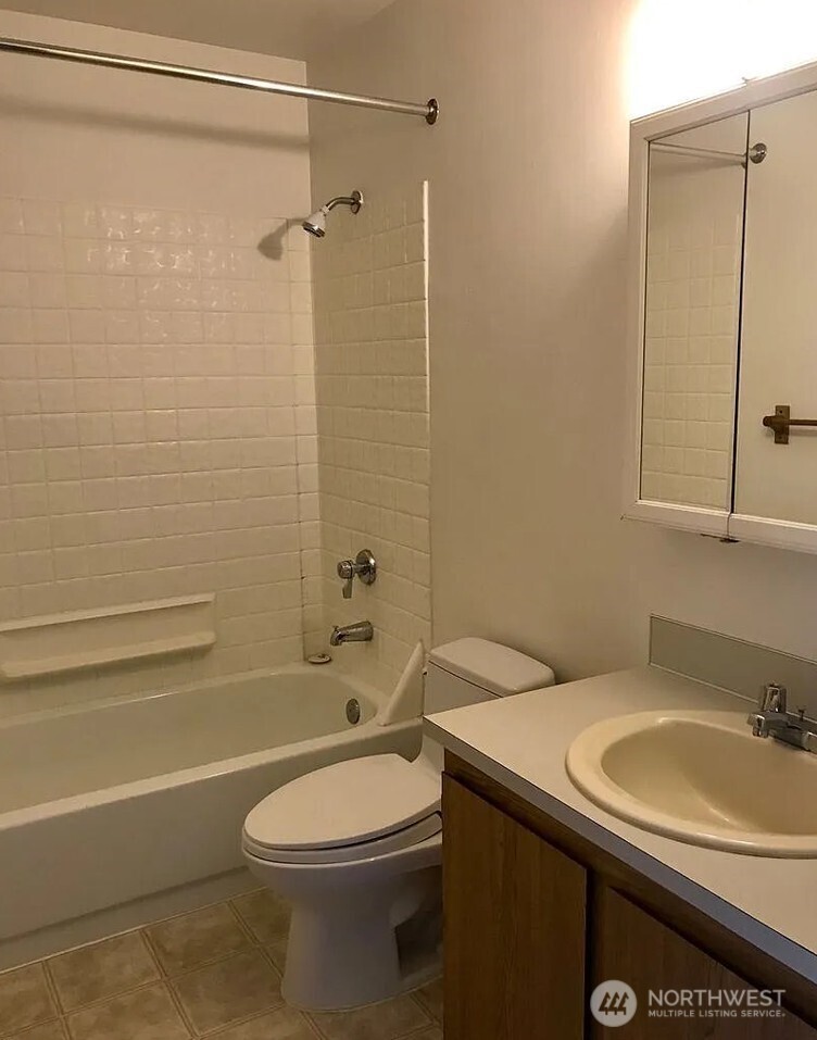 3660 Whitman Avenue North Seattle, WA 98103 - Photo 23 of 40 a bathroom with a sink a toilet and shower