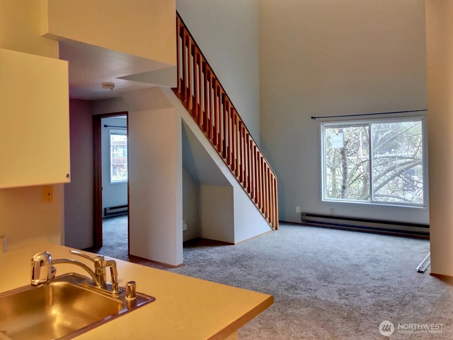 3660 Whitman Avenue North Seattle, WA 98103 - Photo 25 of 40 a view of a livingroom with wooden floor and staircase