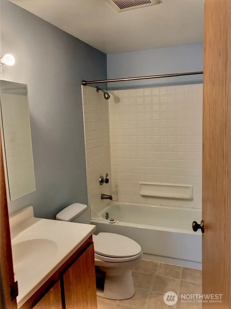 3660 Whitman Avenue North Seattle, WA 98103 - Photo 27 of 40 a bathroom with a sink a toilet and shower