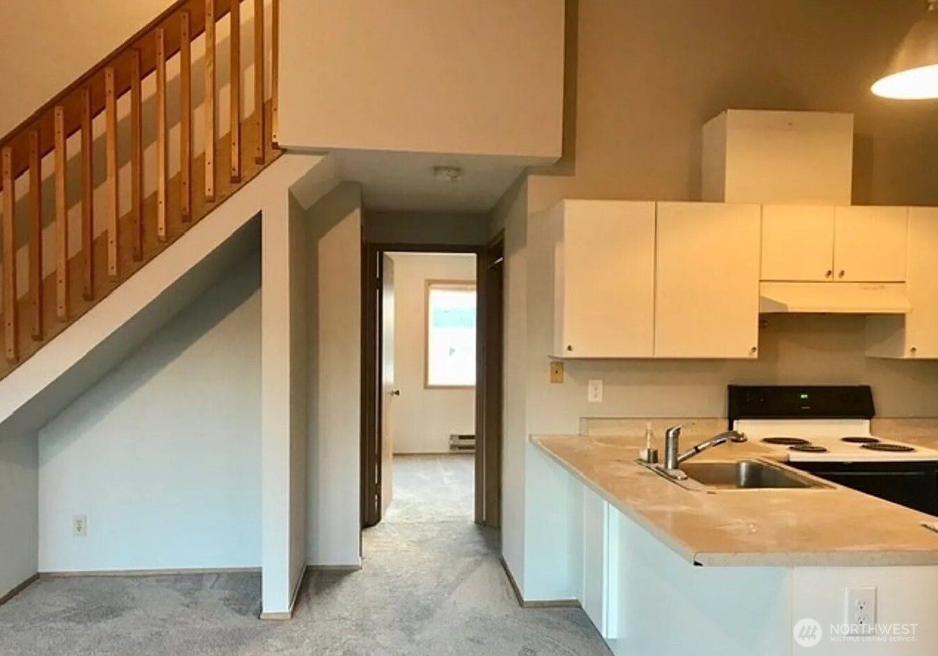3660 Whitman Avenue North Seattle, WA 98103 - Photo 33 of 40 a kitchen with stainless steel appliances granite countertop a sink and a stove